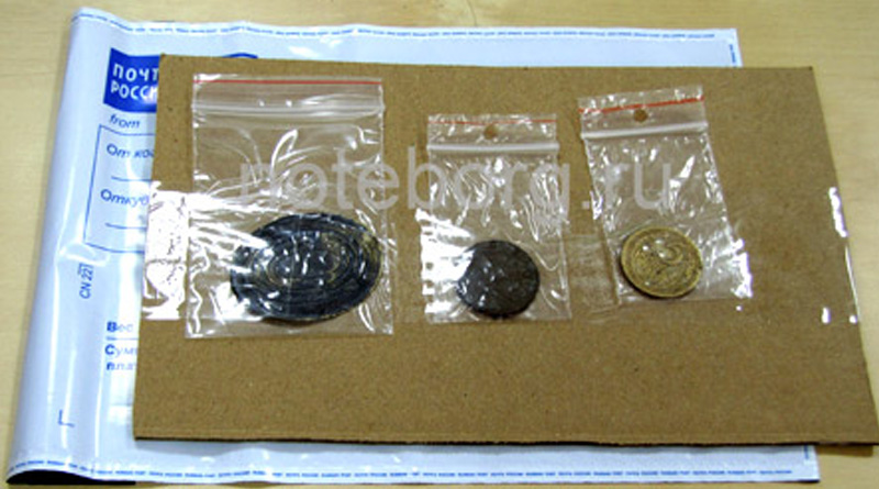 Упаковка монет для отправки на аукцион